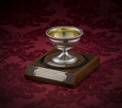 A George III circular silver salt by Daniel Pontifex, London 1800 on raised plinth with reeded foot, gilded interior, engraved with the Nelson crest